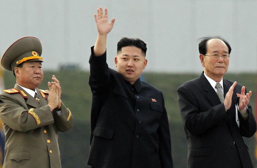 North Korean leader Kim Jong Un, center, accompanied by President of the Presidium of the Supreme People's Assembly Kim Yong Nam, right, waves as he attends the unveiling ceremony for statues of late leaders Kim Jong Il and Kim Il Sung on Mansudae in Pyongyang, North Korea, Friday, April 13, 2012. (AP Photo/Ng Han Guan)